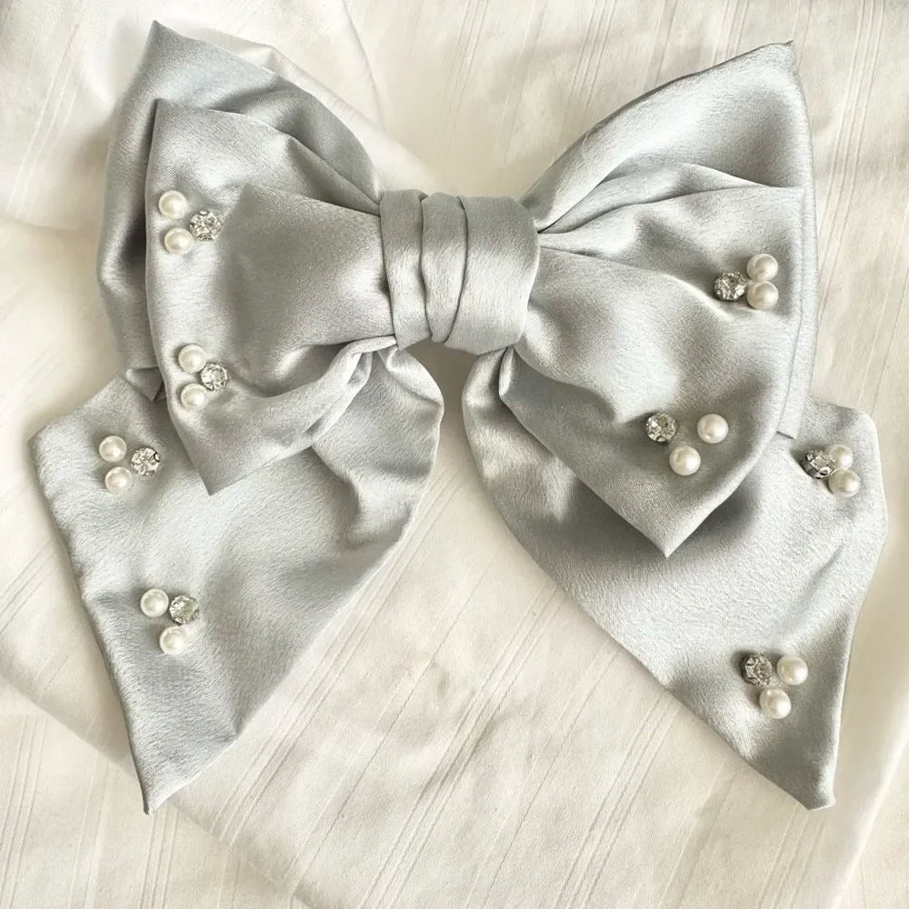 Light grey bow with rhinestone and pearl embellishment